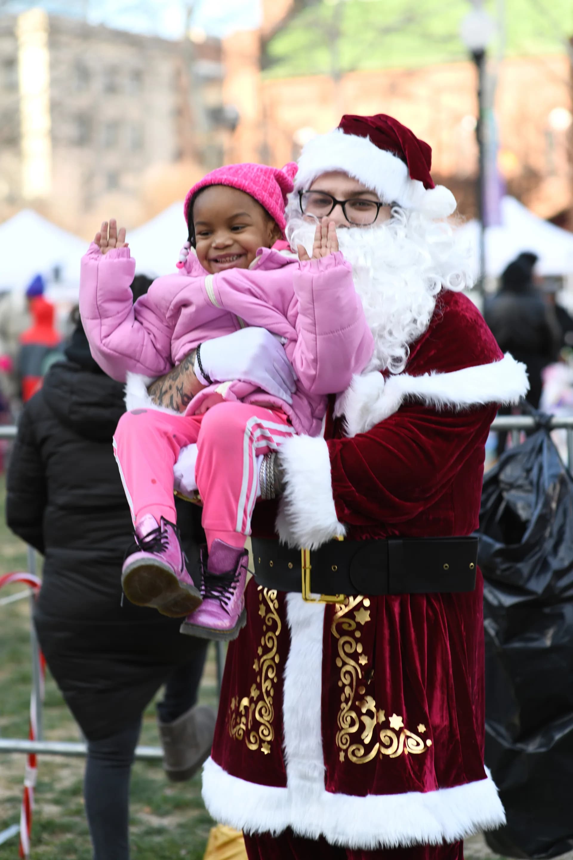Santa Claus with a happy little girl